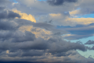 Dramatic puffy clouds isolated against blue skies