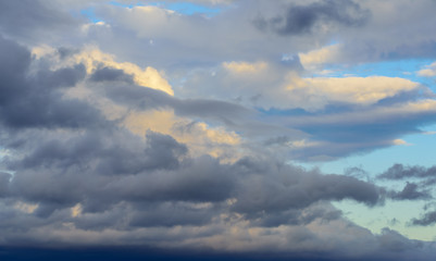 Dramatic puffy clouds isolated against blue skies