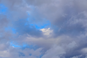 Dramatic puffy clouds isolated against blue skies