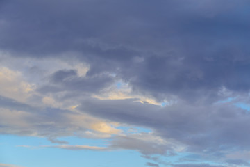 Dramatic puffy clouds isolated against blue skies