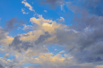 Dramatic puffy clouds isolated against blue skies