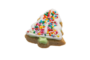 confectionery, gingerbread in the shape of a Christmas tree, decorated with colorful dragees, close-up, isolate