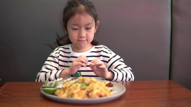 Portrait of Asian child girl Refuse to eat food or food bored, Child Anorexia