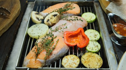 Grilled fish, grilled salmon steak, chicken, aromatic spices and grilled vegetables steak, close-up, 4k.