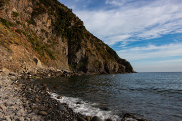 Fototapeta na wymiar Steep Rocky Coastline near Riomaggiore in Cinque Terre Italy