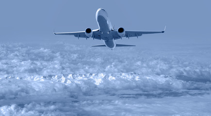 Passenger plane flying in the blue sky