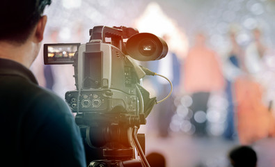 Video camera operator working with his equipment.