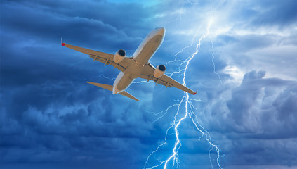 Airplane in the sky with thunder and lightning