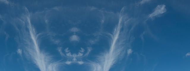 Nephology art. A beautiful sky cloudscape scene, with white (TYPE) cloud in a mid blue sky.