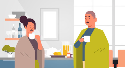 Fototapeta premium sick couple drinking hot tea unhealthy man woman covered with blanket suffering from cold flu virus illness concept modern home kitchen interior flat portrait horizontal vector illustration