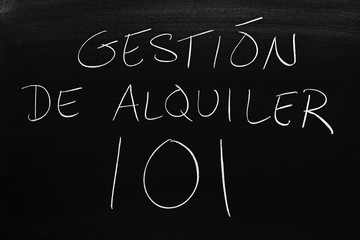 The words Gestión De Alquiler 101 on a blackboard in chalk.  Translation: Rental Management 101