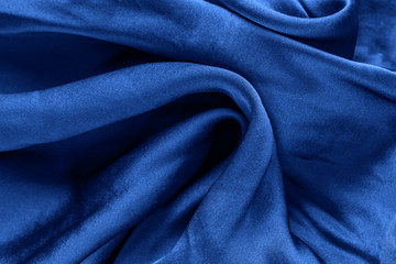 Trend color 2020 classic blue,  silk  background for design.