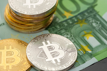 Close-up silver and gold bitcoin coins