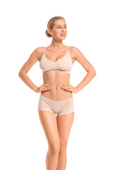 Fototapeta premium Beautiful young woman in underwear on white background