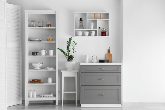 Interior of kitchen with modern shelves