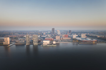 Fototapeta na wymiar Almere city center in early morning haze/smog. Aerial view.