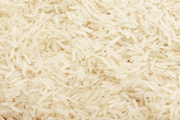 Heap of raw rice as background