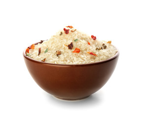 Bowl with raw rice on white background