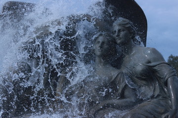 Statues with water pouring on them