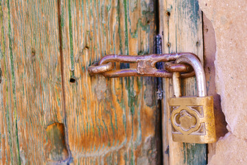 Door with a lock. Urban photo.