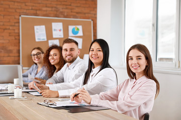 Colleagues discussing issue at business meeting in office