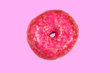 Tasty pink donut on pink background