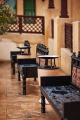 Black carved benches in Souk Madinat Jumeirah