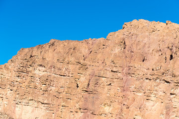 Stone mountain against the blue sky