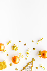 New Year card with tree, balls, present box on white background top-down frame copy space