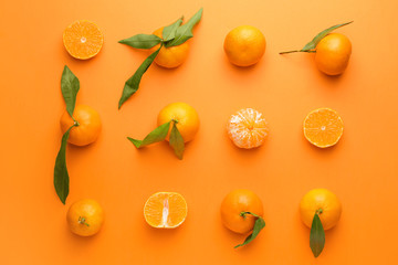 Sweet tangerines on color background