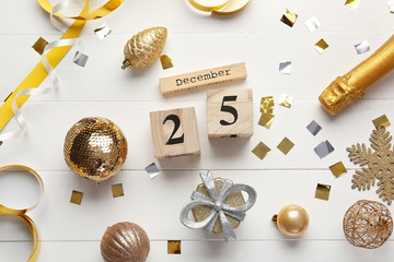 Christmas decor and calendar on wooden background