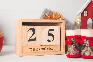 Christmas decor and calendar on table