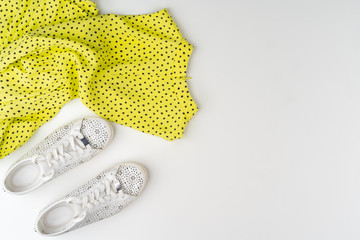 Flat lay of woman summer outfit on white background