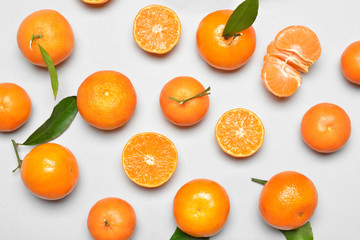 Sweet tangerines on white background