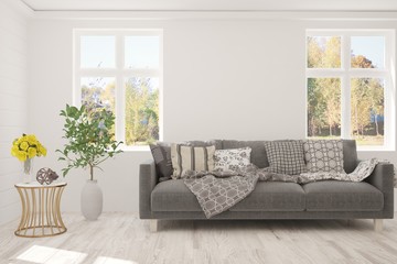 Stylish room in white color with sofa. Scandinavian interior design. 3D illustration