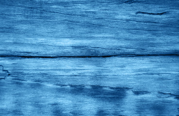 Old wooden background toned classic blue color