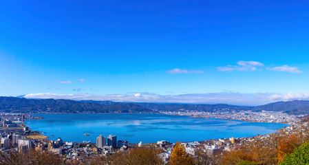 Lake Suwa in autumn reflecting the blue sky