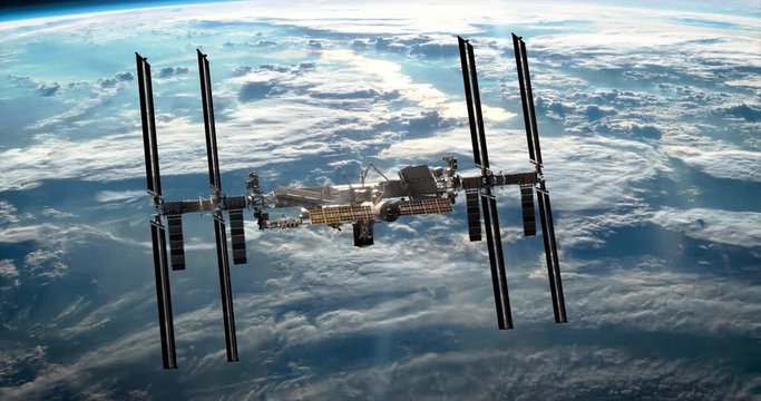 Flight of International Space Station orbiting the blue planet Earth. Camera fly under the ISS at the planet atmosphere. 3D animation. Elements of this image furnished by NASA.