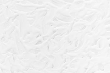 White liquid paint texture with curly curved lines as modern abstract background.