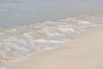 Close up detail of the sea waves washing ashore at the beach Asia Thailand