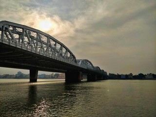 Fototapeta na wymiar River, bridge and sunset