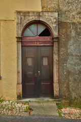 Fototapeta na wymiar old wooden door in brick wall