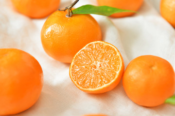 Sweet ripe tangerines on table