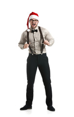 Handsome young man in Santa Claus hat on white background