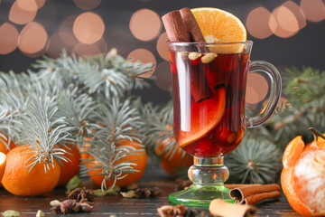 Glass cup of tasty mulled wine on table