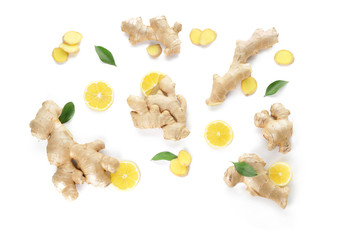 Slices of fresh ginger with lemon on white background