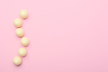 Chocolate Easter eggs on color background