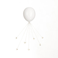 surreal carousel of butterflies that are tied to wires and dance and command a balloon