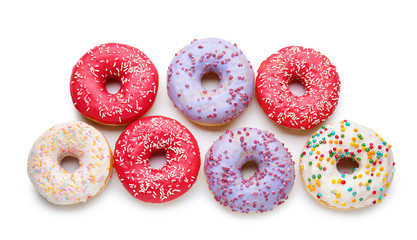 Sweet tasty donuts on white background