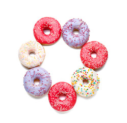 Sweet tasty donuts on white background